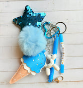 Grigri de sac bleu pompon