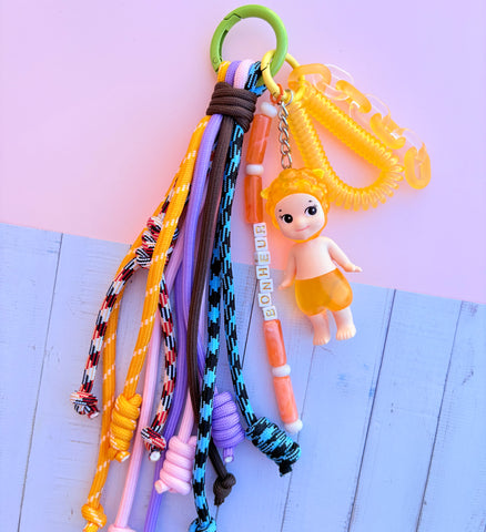 Grigri de sac crocs sonny angel jaune fleur